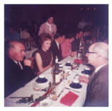 Gerry Townley's father is on the right hand side of the photo and a man named Rooney and his wife are on the left. Rooney's daughter is the waitress, Bernadette Rooney was her name. They lived in the house Peter Queally owned, opposite The Anchor.
