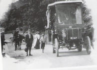 Photo from the RIAC archive of the Dunmore Bus c.1909, with the Haven wall in the background