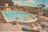 Angelina sunbathing by the pool and Louis on the roof of the sauna room, this pic was used as a postcard for the hotel.