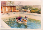Cleaning the pool, early seventies, in Strangman's punt . Louis O'Dwyer in the yellow trousers
